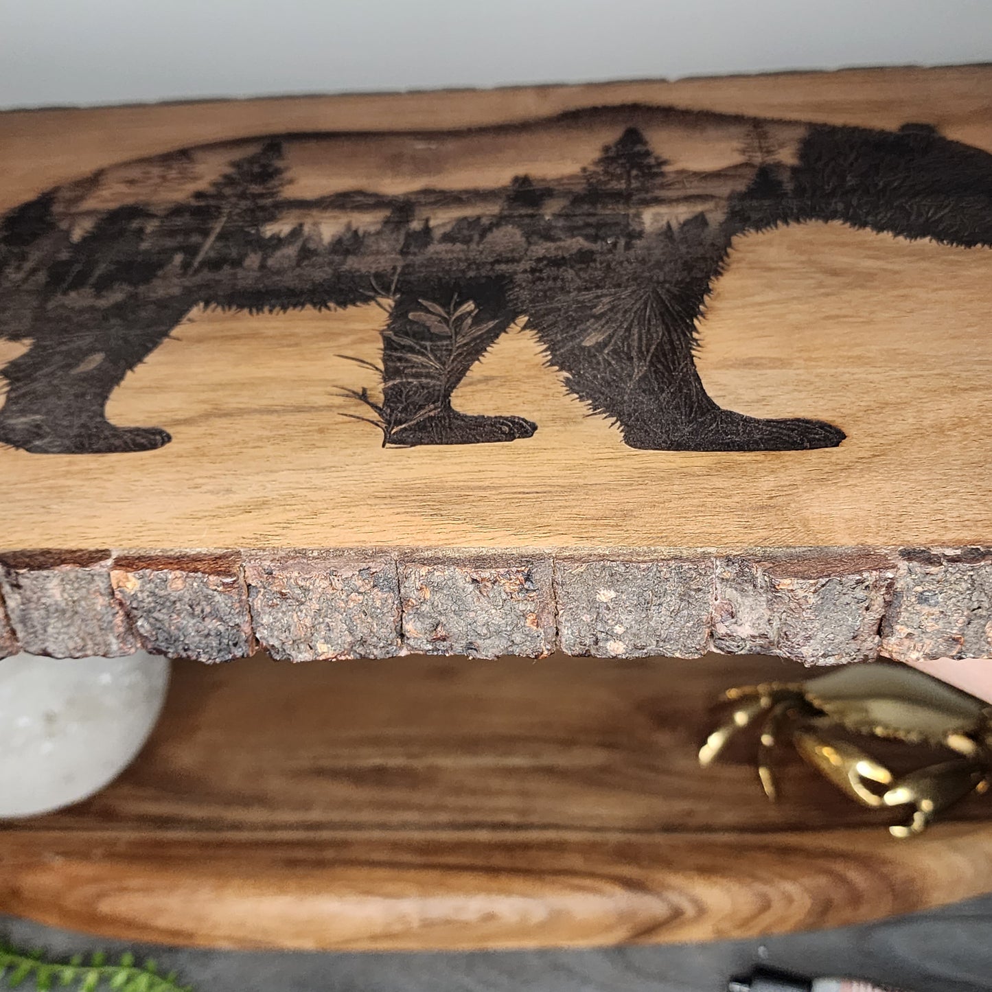 Bear with pine trees, bark edge