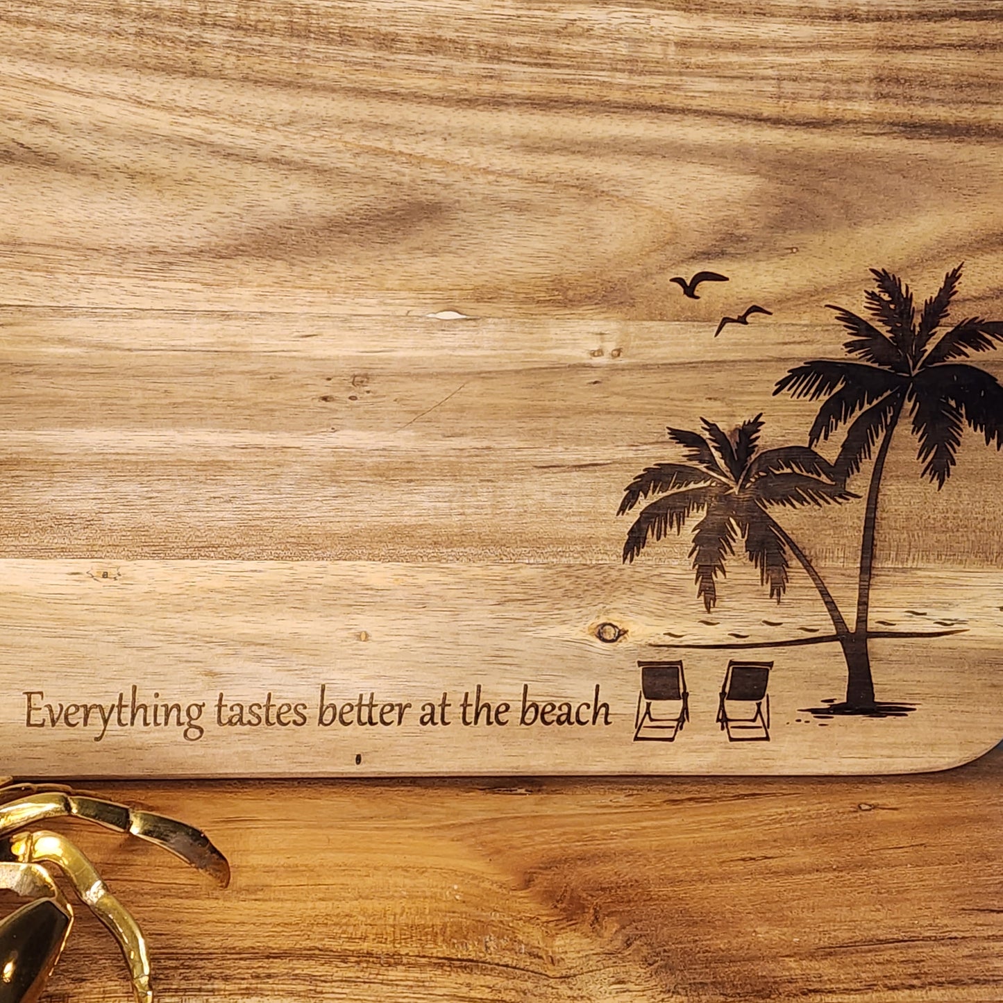 Everything tastes better at the beach serving board with wave design on handle